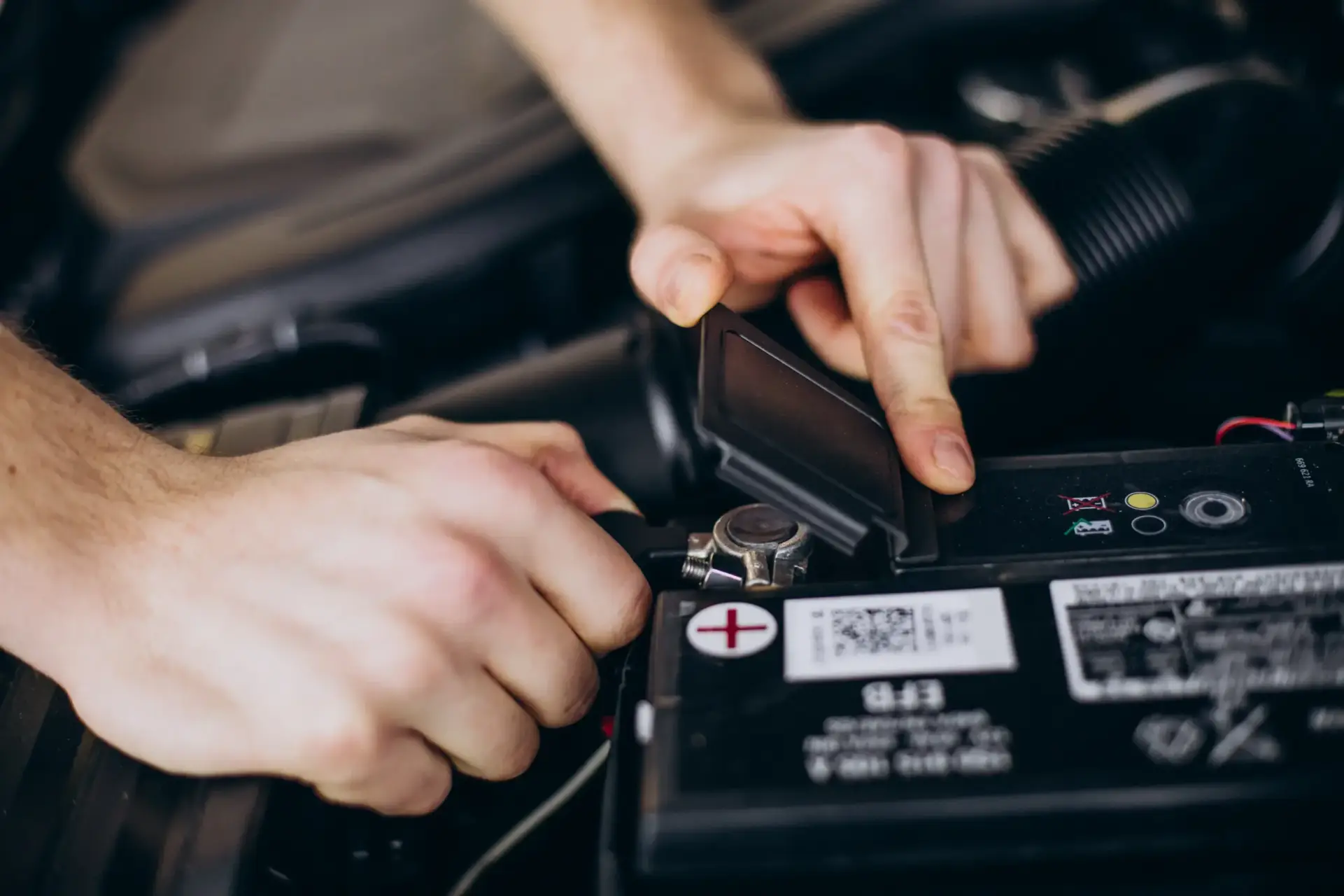 AONE car batteries professional moving towards customer to do the car battery replacement AONE car batteries professional moving towards customer to do the car battery replacement